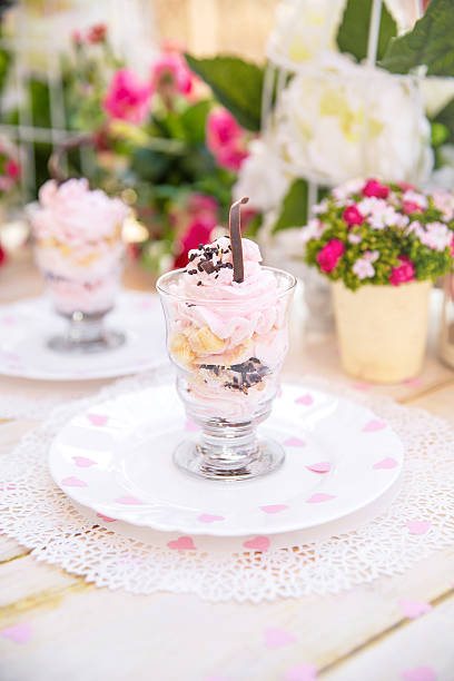 istock Pink cake souffle in a glass at sunset 511593686