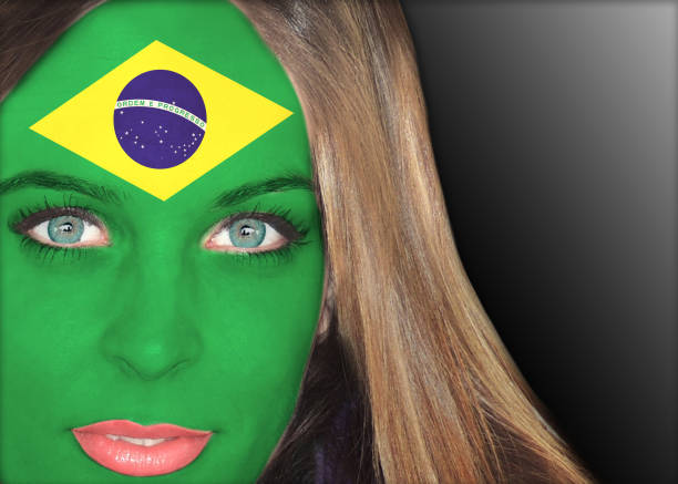 Human face painted with flag of Brazil