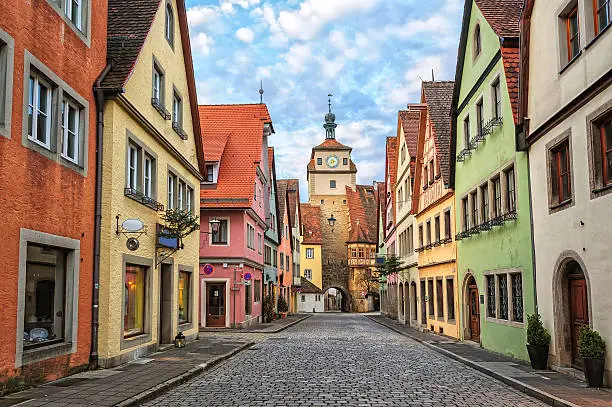 Colorful houses on a street in medieval german town Rothenburg ob der Tauber, Germany