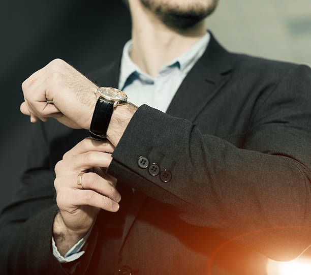 istock watch on businessman wrist 511597928