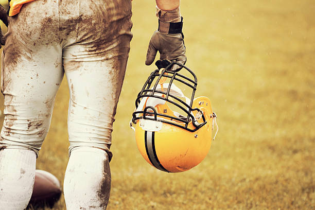 American football player banner with neon lights. Template for a sports magazine on the theme of American football with copy space. Mockup for betting ads.