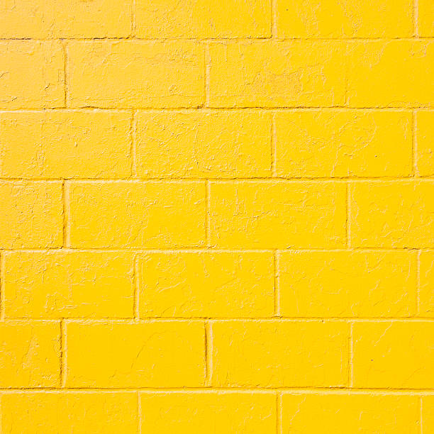 istock square part of yellow painted brick block wall 511598926