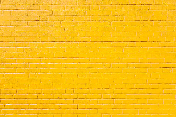 istock horizontal part of yellow painted brick wall 511599046