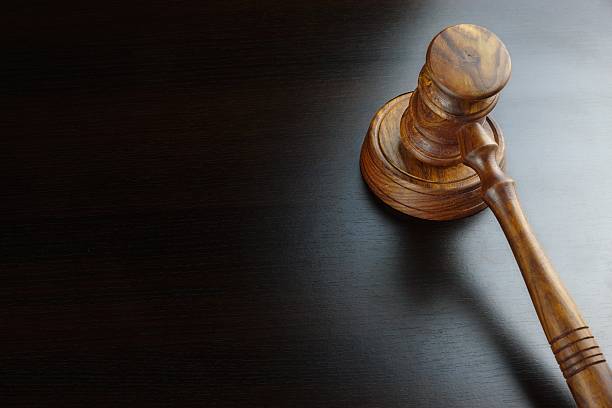 istock Judges Or Auctioneers Walnut Gavel On The Black Table 511600806