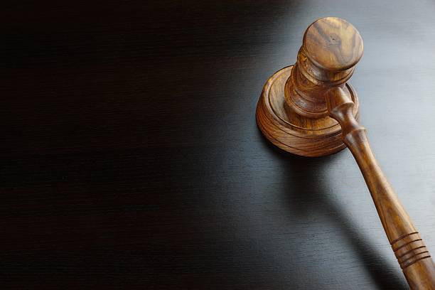 Judges Or Auctioneers Walnut Gavel On The Black Table stock photo