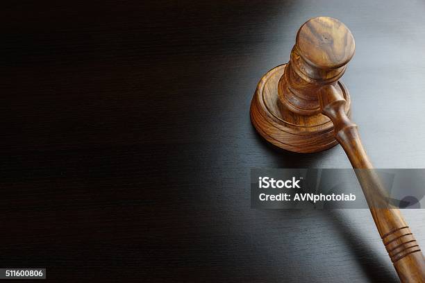 Judges Or Auctioneers Walnut Gavel On The Black Table Stock Photo - Download Image Now