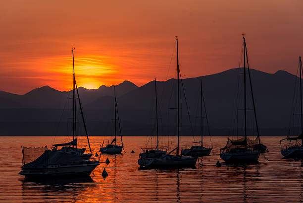istock Sailing Boats on lake Garda with sunset, Italy 511601352