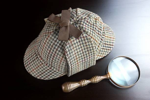 istock Deerstalker Hat,   And Vintage  Magnifying Glass On Black Background 511602140