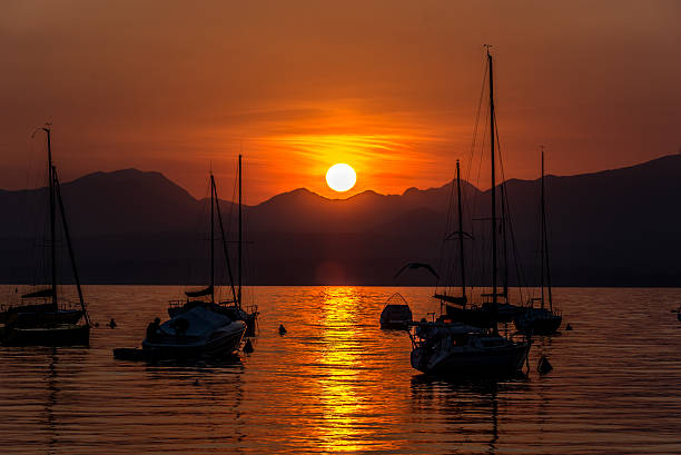 istock Sailing Boats on lake Garda with sunset, Italy 511602298