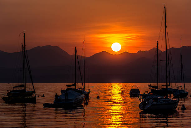 istock Sailing Boats on lake Garda with sunset, Italy 511603576