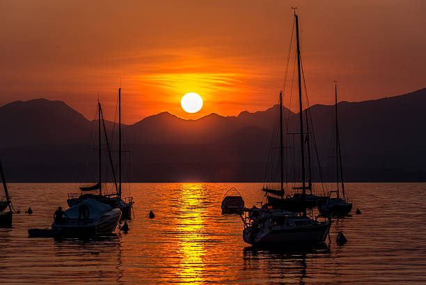 istock Sailing Boats on lake Garda with sunset, Italy 511603778