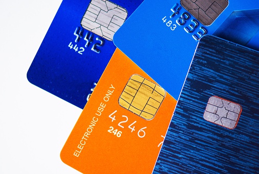 Four Premium Credit Cards with Microchip Closeup Photo.