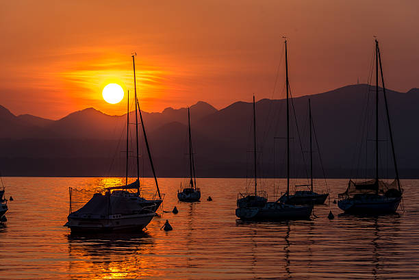 istock Sailing Boats on lake Garda with sunset, Italy 511604362