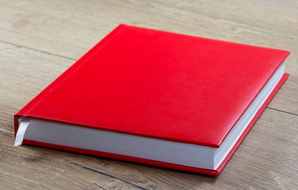 Red notebook with hardcover on the table stock photo