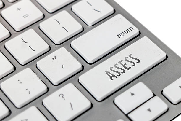 The word of assess written on keyboard concept.