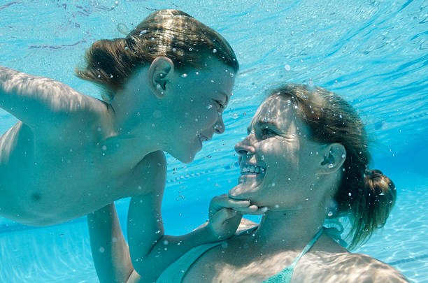 istock Son and Mother play underwater on a summer day 511610052