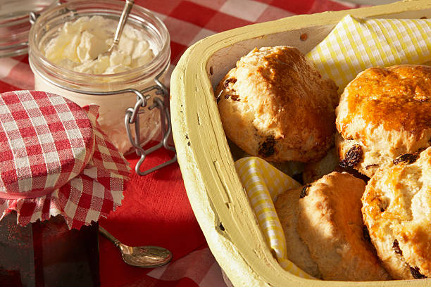 istock Home made scones with jam and fresh clotted cream. 511610602