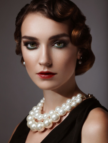 A woman wearing a beautiful pearl necklace