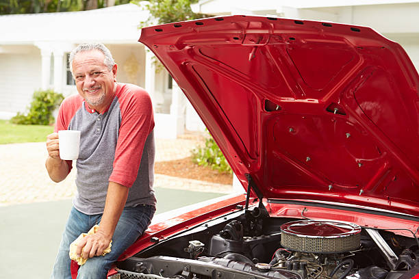 istock Retired Senior Man Working On Restored Classic Car 511618803