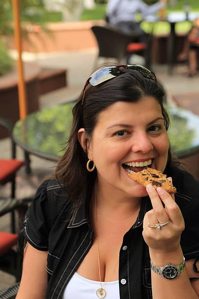 istock Lady Ready to Eat Chocolate Chip Cookie 511622661
