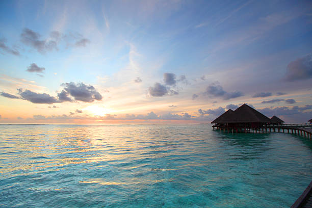 istock maldivian houses on sunrise 511622953