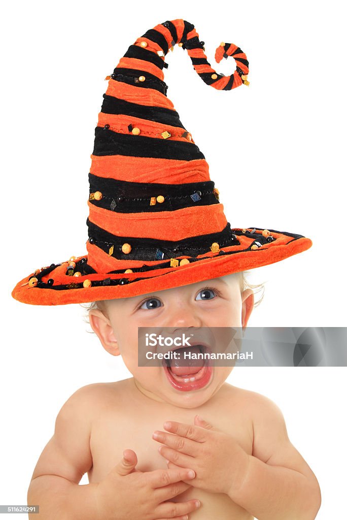 Halloween baby Adorable ten month old baby wearing a Halloween witch hat. 12-17 Months Stock Photo