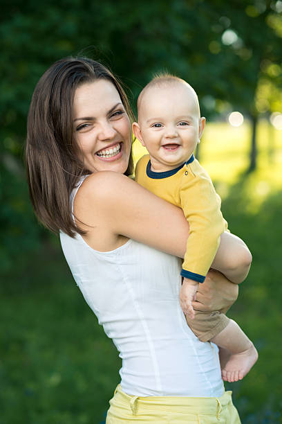 istock Happy mother holding a young son 511624745