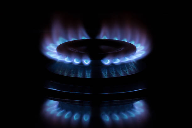 gas flame dark background stock photo