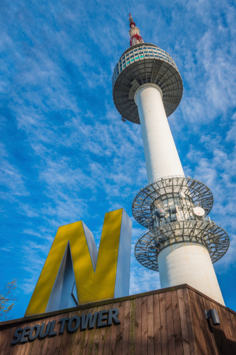 Seoul, South Korea - 29th April 2013: The iconic spire of the N Seoul Tower, or Namsan Tower, soaring above its name on the summit of Namsan Mountain to the blue skies above Seoul, South Korea's vibrant capital city.