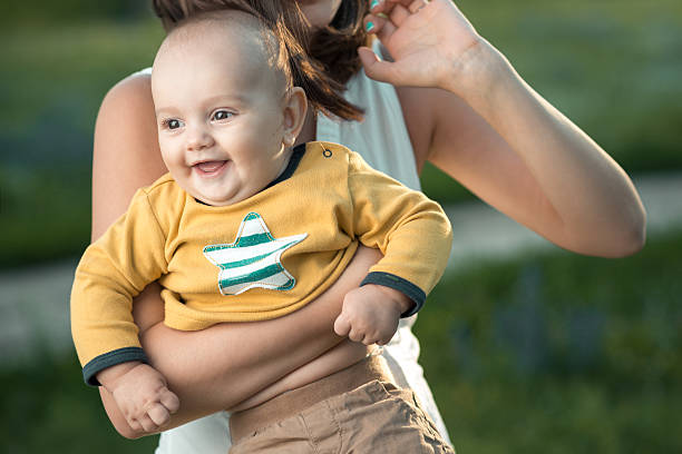 istock Happy mother holding a young son 511643853