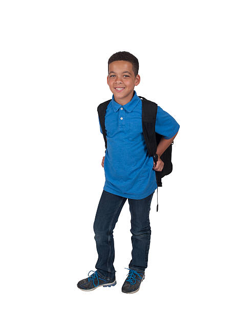 Mixed race boy with back pack stock photo