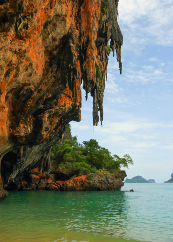 Krabi beach with red cliff and blue sky