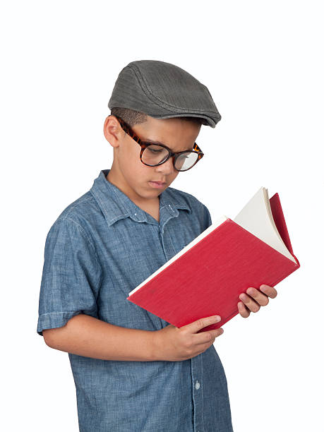 Studying Boy with hat and glasses stock photo