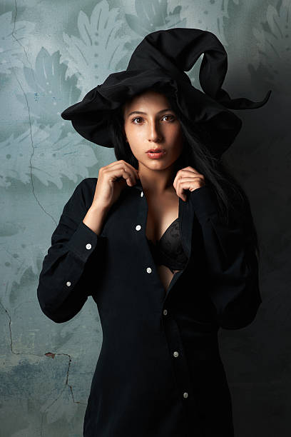 istock girl in a witch costume sexy looks 511646637