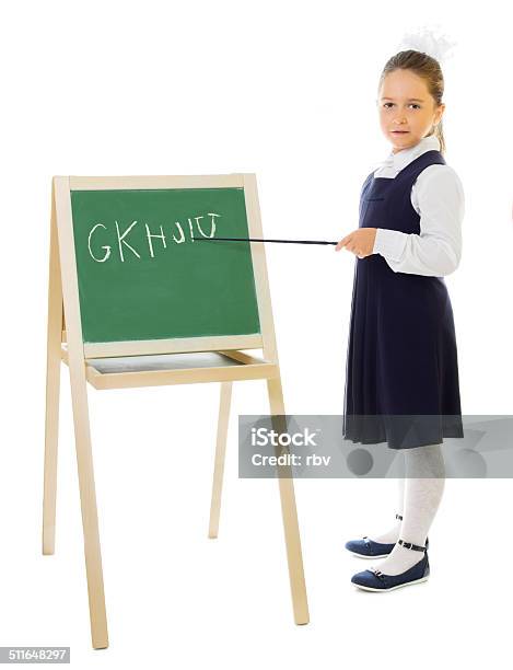 Little Schoolgirl With Blackboard Isolated Stock Photo - Download Image Now - 4-5 Years, 6-7 Years, Alphabet