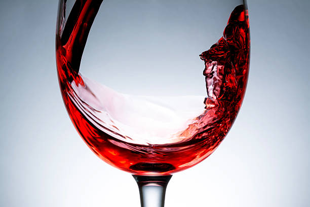 istock stream of wine being poured into a glass,  splashing, splash, 511651720