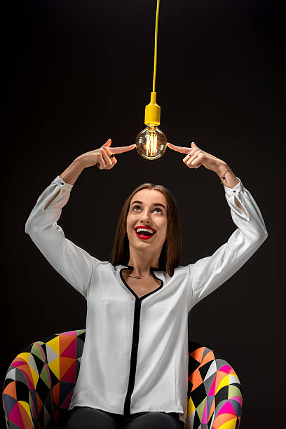 istock Woman with illuminated retro lamp 511653072