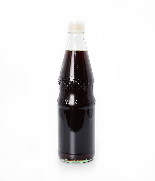istock sauces in glass bottles on white background 511653208