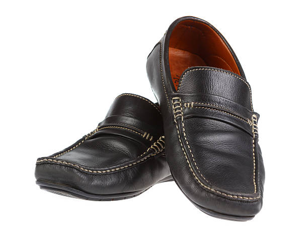 istock black man's shoes isolated on white background. 511656874