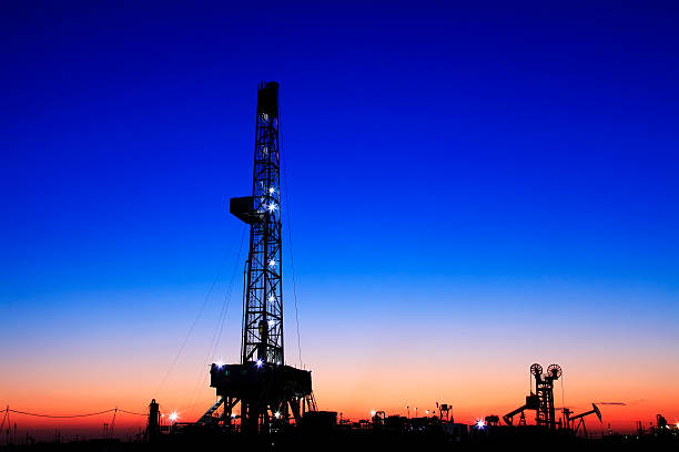 istock oilfield derrick at night 511658650