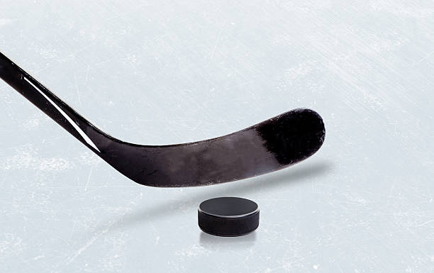 istock Ice Hockey Stick and Puck With Copy Space 511662994