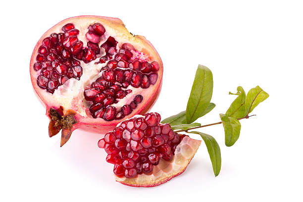 istock Ripe pomegranates with leaves isolated on a white background 511663052