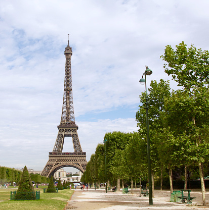 The Eiffel Tower in Paris France as seen from the Champ de Mars the open green space below the landmark