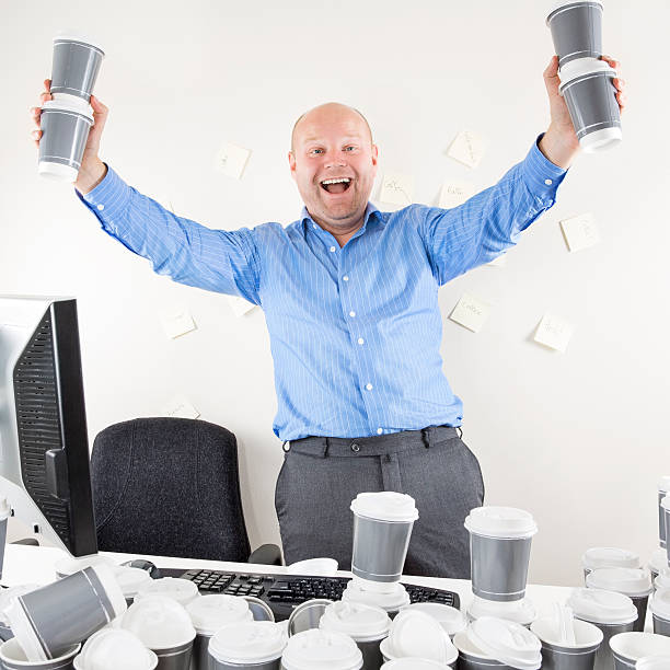 istock Happy and coffee addicted businessman at office 511665083