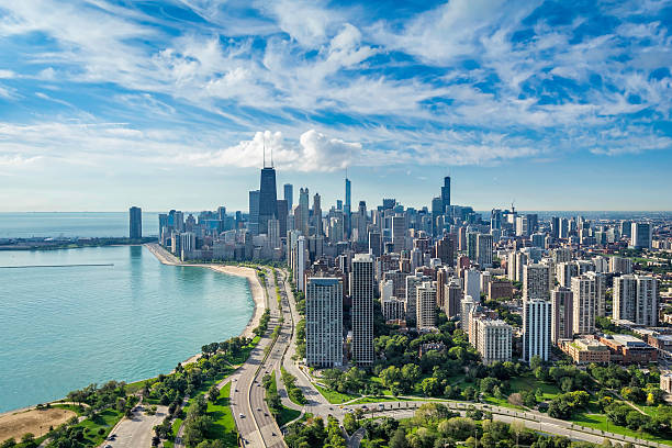Chicago Skyline aerial view Chicago Skyline aerial view with road by the beach lakeshore photos stock pictures, royalty-free photos & images