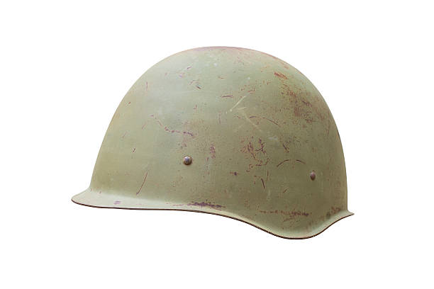 Old military helmet from Second World War with scratches and stock photo
