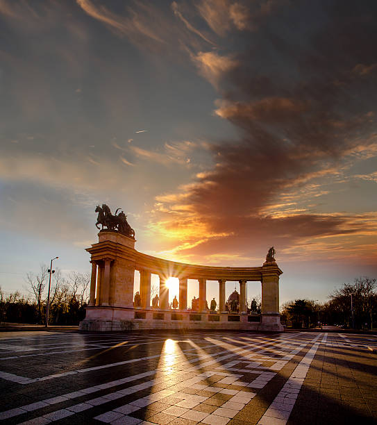 Memorial Monument on Heroes Square in Budapest against evening sky, HungaryMemorial Monument on Heroes Square in Budapest against sunrise, Hungary
