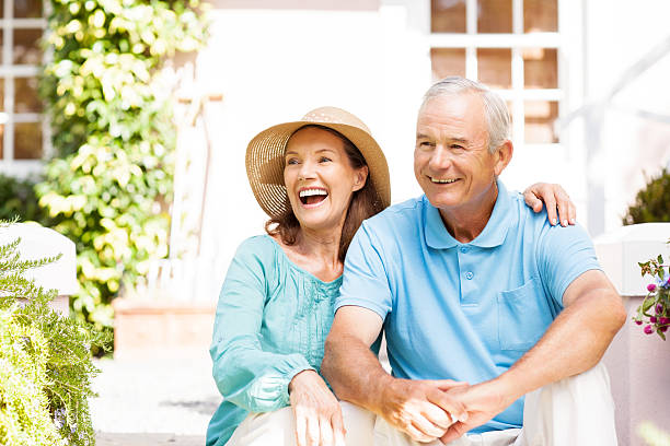 istock Happy Senior Couple Sitting In Garden 511666229