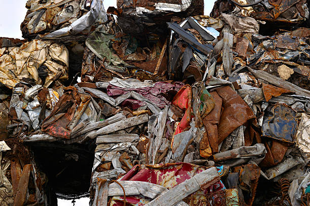 istock Pile of compressed cars in blocks for processing 511667036
