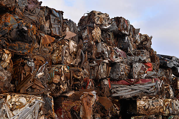 istock Pile of compressed cars in blocks for processing 511667102